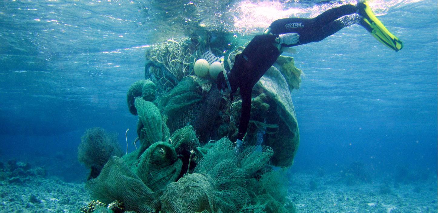 https://www.nfwf.org/sites/default/files/styles/hero_image_1446w_scale_/public/2019-12/marine-debris-removal-diver-conducts-an-assessment-midway-atoll-1446x705.jpg?itok=C8Vhm-nm